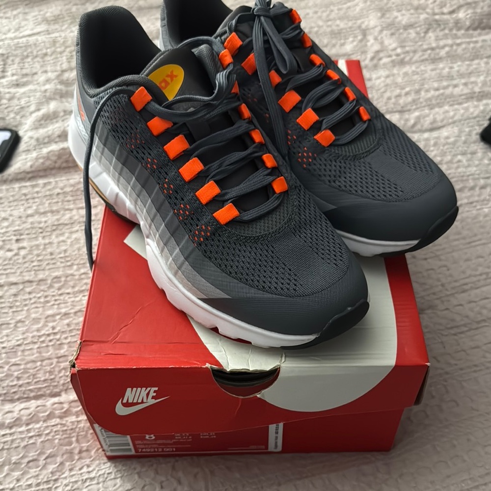 Nike women’s Dark Gray and Bright Orange Athletic Shoes